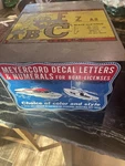 Vtg Meyercord Decal Letters & Numerals For Boat Licenses Metal Box Display 1958. Fixed Price $175.00.