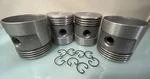 New Old Stock Mercury Inboard Full Round Skirt Pistons Set With Rings Type +.040. Fixed Price $29.15.